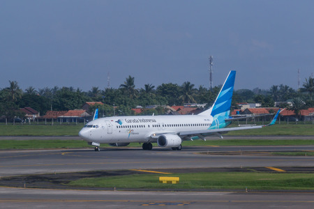 Garuda Indonesia plane on a runway of Soekarno-Hatta International Airport in Jakarta, Indonesia.のeditorial素材
