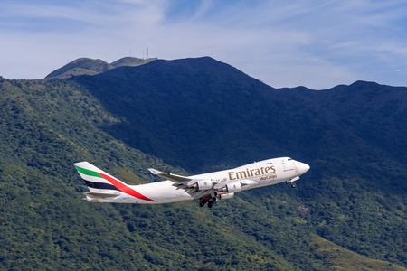 Emirates airplane departing from the Hong Kong International Airport. About 90 airlines operate flights from HKIA to over 150 cities across the globe.のeditorial素材