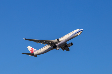 China Airlines airplane departing from the Hong Kong International Airport. About 90 airlines operate flights from HKIA to over 150 cities across the globe.のeditorial素材