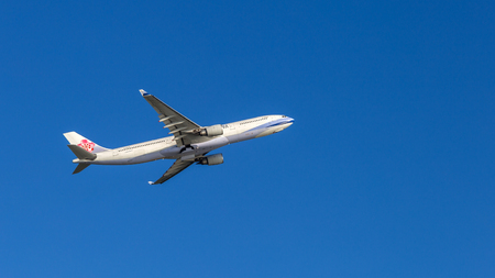 China Airlines airplane departing from the Hong Kong International Airport. About 90 airlines operate flights from HKIA to over 150 cities across the globe.のeditorial素材