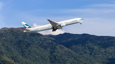 Cathay Pacific airplane departing from the Hong Kong International Airport. About 90 airlines operate flights from HKIA to over 150 cities across the globe.のeditorial素材