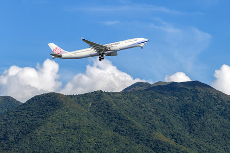 China Airlines airplane departing from the Hong Kong International Airport. About 90 airlines operate flights from HKIA to over 150 cities across the globe.のeditorial素材