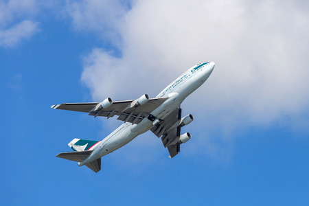 Cathay Pacific airplane departing from the Hong Kong International Airport. About 90 airlines operate flights from HKIA to over 150 cities across the globe.のeditorial素材