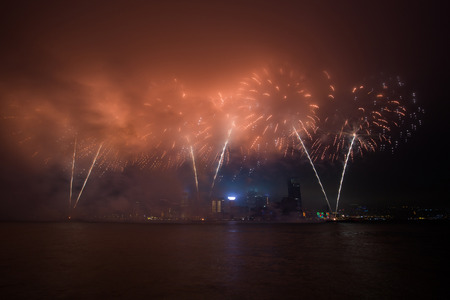 Fireworks show along Victoria harbor in Hong Kong, China.の写真素材