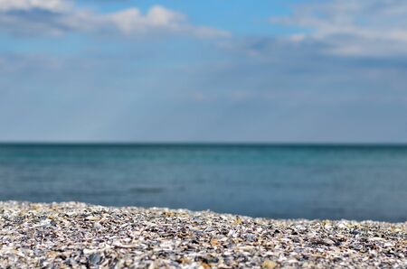 Colorful sea view from the shore. The shore of the Ionian sea during  summer with blurred sky in background.Summer vacationの写真素材