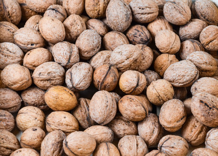 Full frame  shot of dried  walnuts pile  .