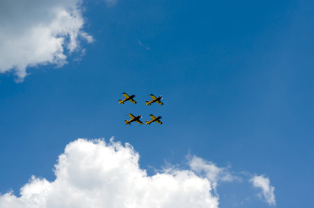 Low angle view of  colorful parade airplane flying in sky .
