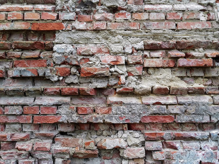 Old abandoned cracked  brick wall 