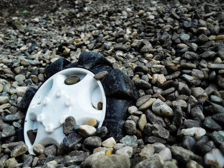 Truck toy wheel forgotten in gravel