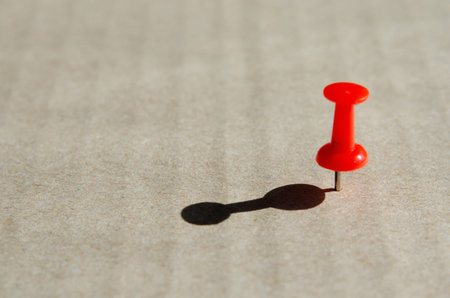 Concept of loneliness and ethnic separation with  plastic head push pin . Marking a goal, a desire...