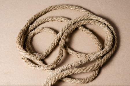 Close-up  of   natural hemp rope. Concept of togetherness or disorder .