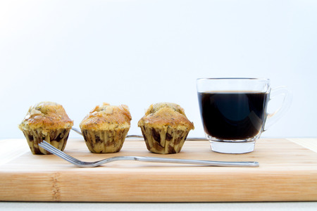 3 banana cakes with a cup coffeeの写真素材