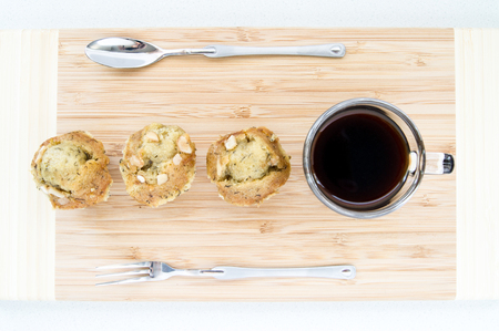 3 banana cakes with a cup coffeeの写真素材