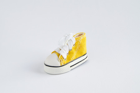 Yellow sneaker on whiteの写真素材