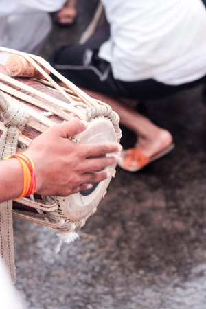 mridangam - a hand playing an classical indian percussion musical instrument