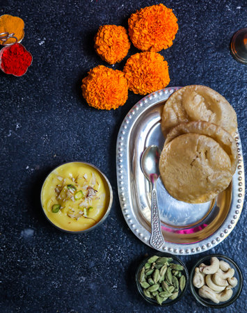 a top view of famous indian sweet shrikhand puri usually prepared in all auspicious days and...