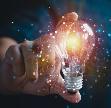 A hand cradles a bright, illuminated light bulb, surrounded by a vibrant, energetic aura of colorful...