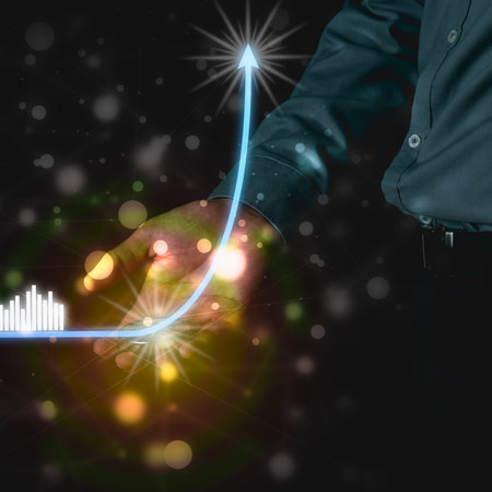 A close-up of a welder's hands creating a glowing blue arrow that arcs upwards, symbolizing growth and progress.の写真素材