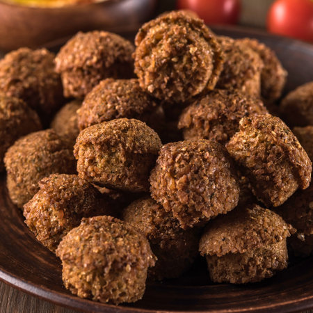 A close-up shot of a generous pile of perfectly cooked, golden-brown meatballs, ready to be enjoyed.の写真素材