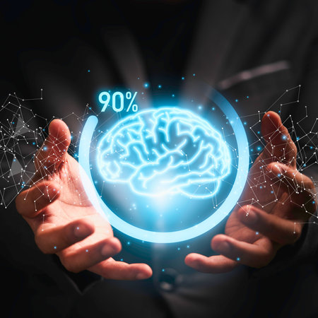 Two hands cradle a luminous, holographic brain. A progress bar shows 90 percent, suggesting advanced intelligence or activation.の写真素材