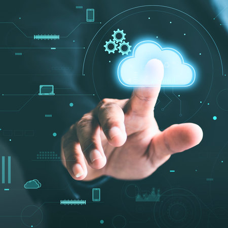 A person's hand reaches out to touch a bright, glowing cloud icon with gears inside, set against a...