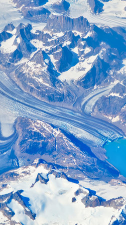 An abstract close-up of paint swirls in shades of blue and white, with a textured, almost landscape-like appearance.の写真素材