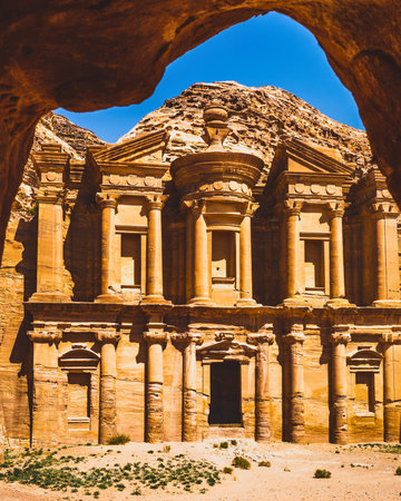 The iconic Al-Khazneh, a magnificent treasury carved directly into a sandstone cliff face in the ancient city of Petra, Jordan.の写真素材