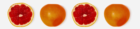 A top-down view of two whole grapefruits and two sliced grapefruits, showcasing their vibrant red flesh and textured rind.の写真素材