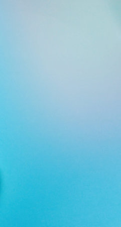 A soft, abstract gradient transitions from a light sky blue to a pale white, creating a serene and...