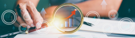 Hands interacting with a glowing digital interface, symbolizing innovation, data analysis, and future business strategies.の写真素材