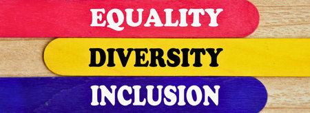 Three colorful wooden planks with the words Equality Diversity and Inclusion written on them in white letters.の写真素材