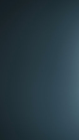 A deep blue gradient transitions from darker to lighter shades, featuring a subtle, almost imperceptible textured pattern.の写真素材