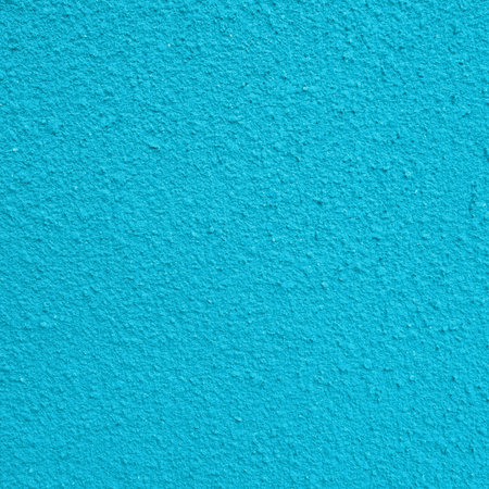A close-up, abstract view of a bright turquoise surface with subtle ripples and light reflections.の写真素材