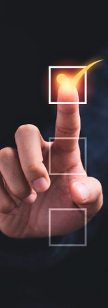 A close-up of a finger touching a digital interface, with glowing lines and data streams emanating from the fingerprint.の写真素材