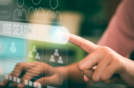 A finger touches a glowing search bar on a futuristic digital screen, symbolizing online job searching and human resources.の写真素材