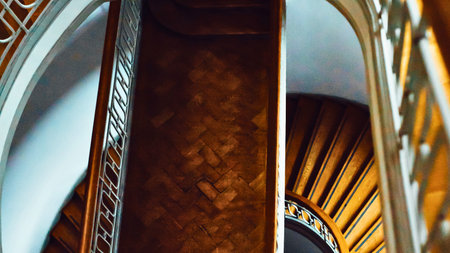 Close-up view of ornate wooden carvings and architectural elements within a building, showcasing detailed craftsmanship and rich textures.の写真素材
