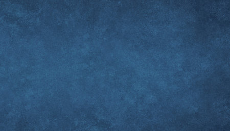 A close-up, textured abstract background in varying shades of deep blue, suggesting a mottled or painted surface.の写真素材