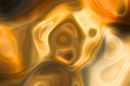 A vibrant abstract image featuring swirling patterns of golden and orange light, evoking a sense of cosmic energy and warmth.の写真素材