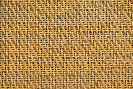 A detailed, full frame, close-up view of the rough, natural texture of woven burlap fabric. The weave is clearly visible.の写真素材