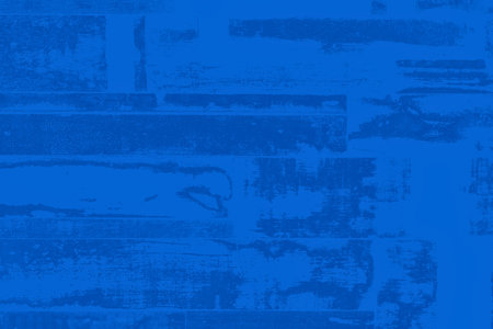 A deep blue abstract background with subtle horizontal lines and textured patterns creating a sense of depth and movement.の写真素材