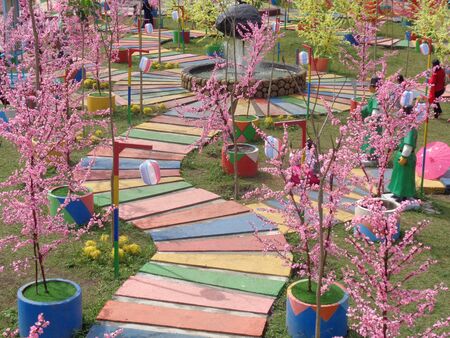 Kediri, East Java Indonesia - 17 Desember, 2019: The visitor wearing Korean traditional dress Hanbok in Gyeongbokgung palace and cherry blossom flower.のeditorial素材