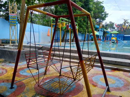Kediri, Melta Waterland, East Java, Indonesia - March 27th, 2020 : Closure of swimming pool due to corona virus. Lockdown process in Indonesia. The pool looks so dirty and quiet, without people.のeditorial素材
