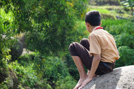 Lonely Indonesian student wear boy scout uniformの写真素材