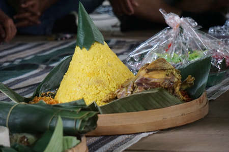 Indonesian thanksgiving menu that called nasi tumpeng (rice with cone shape). Nasi tumpeng usually eat at birthday party, graduation or thanksgivingの写真素材