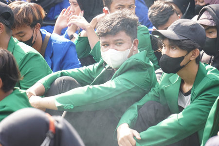 Kediri, East Java, Indonesia - April 18th, 2022 : Indonesian students demonstrate about rising...