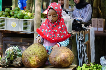 Kediri, East Java, Indonesia - December 12th, 2021 : People buy food on Pasar ndeso Sor Preng Mojo. Pasar ndeso means a traditional market that sells Indonesian traditional snacksのeditorial素材