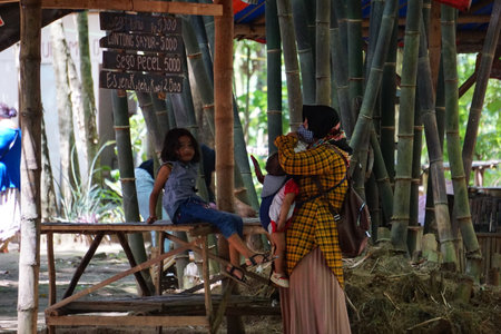 Kediri, East Java, Indonesia - December 12th, 2021 : People buy food on Pasar ndeso Sor Preng Mojo. Pasar ndeso means a traditional market that sells Indonesian traditional snacksのeditorial素材