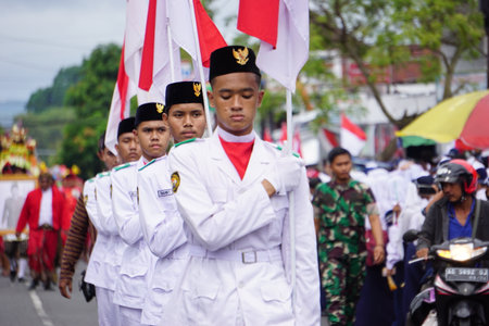 Paskibraka (Indonesian flag raiser) with national flag during grebeg pancasilaのeditorial素材