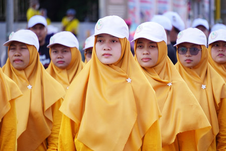 Indonesian participating in marching (baris berbaris) to celebrate Indonesian independence dayのeditorial素材