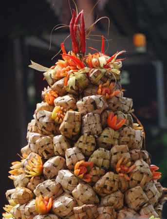 Ketupat is a typical Indonesian dish made of rice, wrapped in coconut leaves and boiled in hot water and usually eaten on idul fitriの写真素材